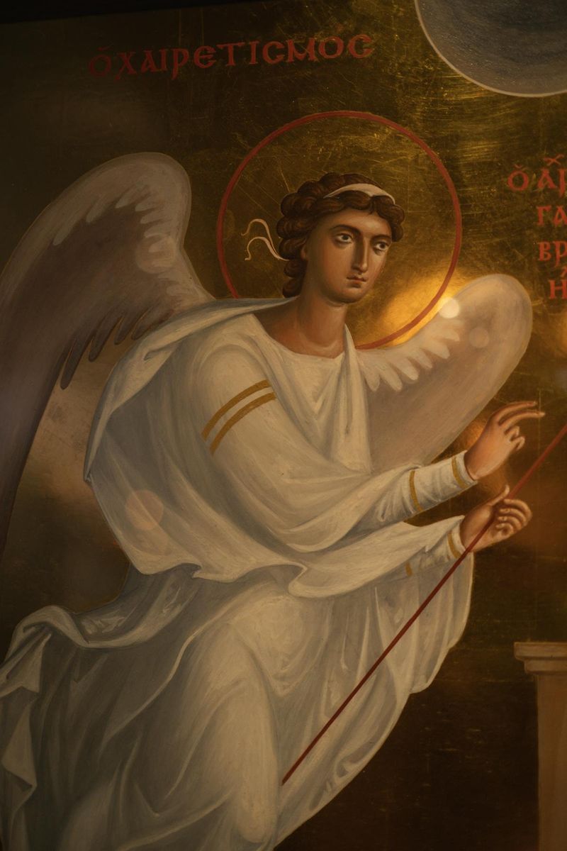 Orthodox church fresco depicting an angel with Greek inscription, representing the patristic tradition that defended Christ's divinity