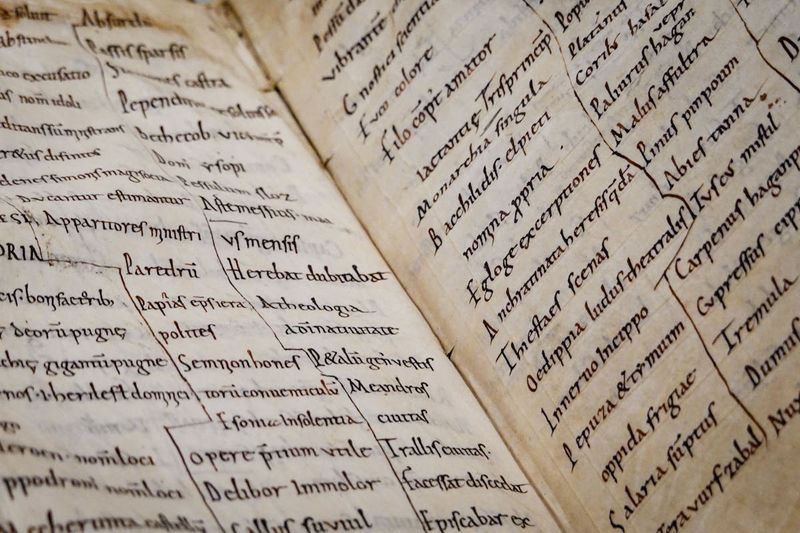 Close-up of an ancient manuscript with Latin text, representing the scholarly and textual world of early Christian theological debate