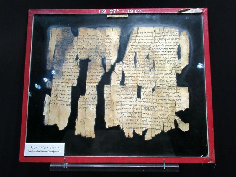 Fragments of a Dead Sea Scroll manuscript displayed under glass at Qumran