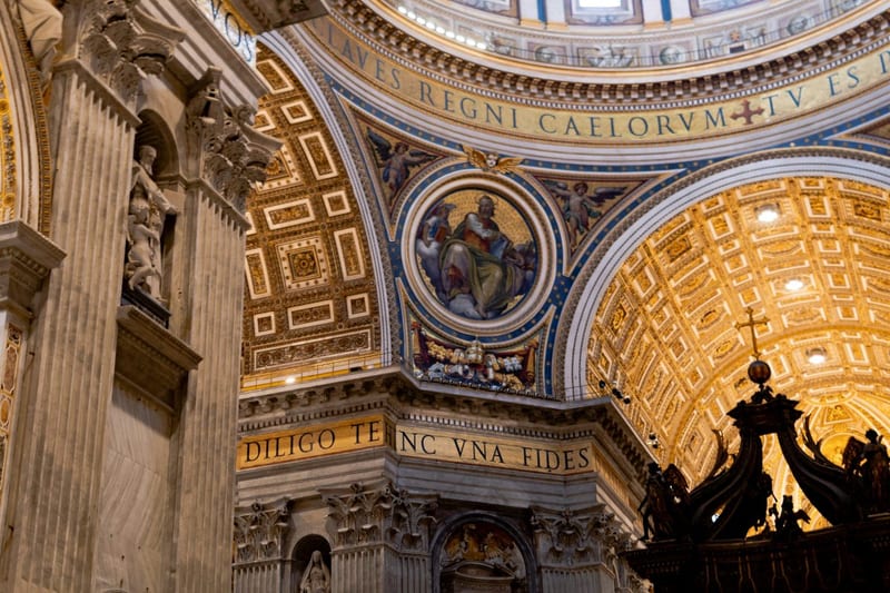 Interior of a grand church with a domed ceiling and rows of seated clergy, evoking the conciliar setting in which Dei Verbum was promulgated