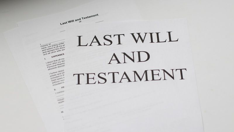 Printed 'Last Will and Testament' document resting on a desk, representing probate and estate distribution