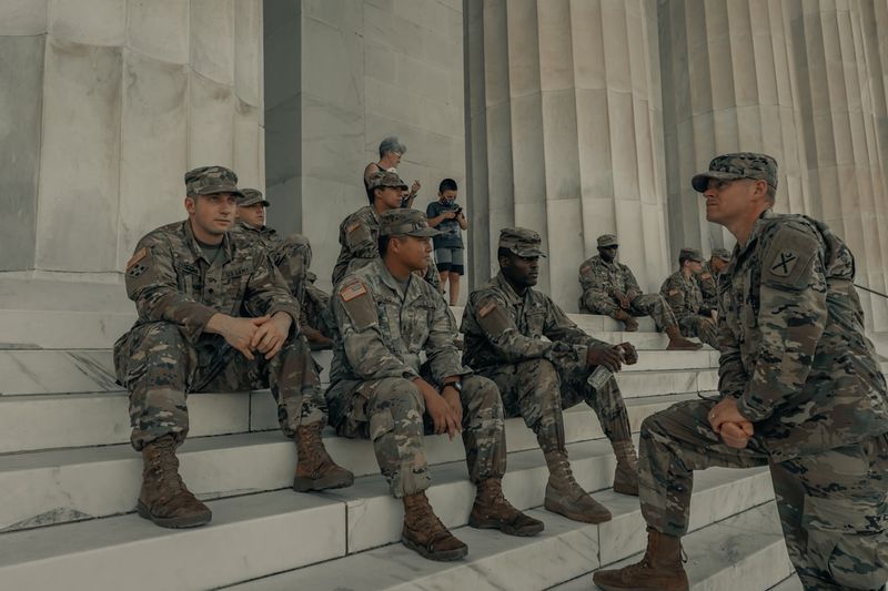 U.S. Army soldiers in uniform on the steps of the Lincoln Memorial