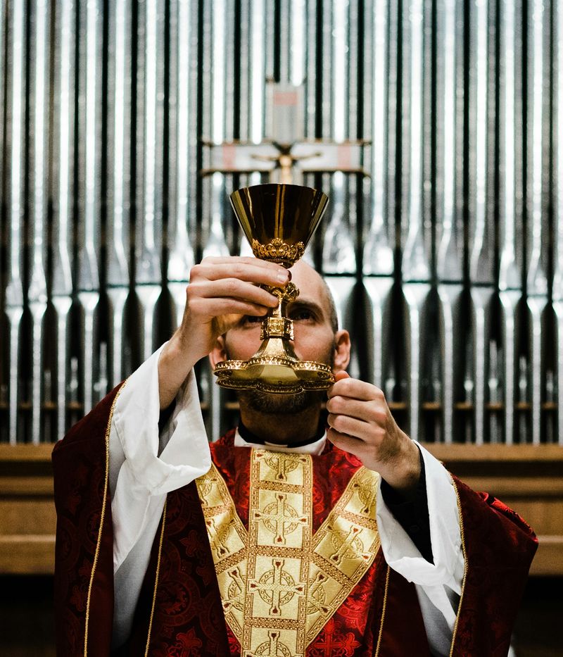 A priest elevates the chalice during the consecration of the Eucharist at a Catholic Mass