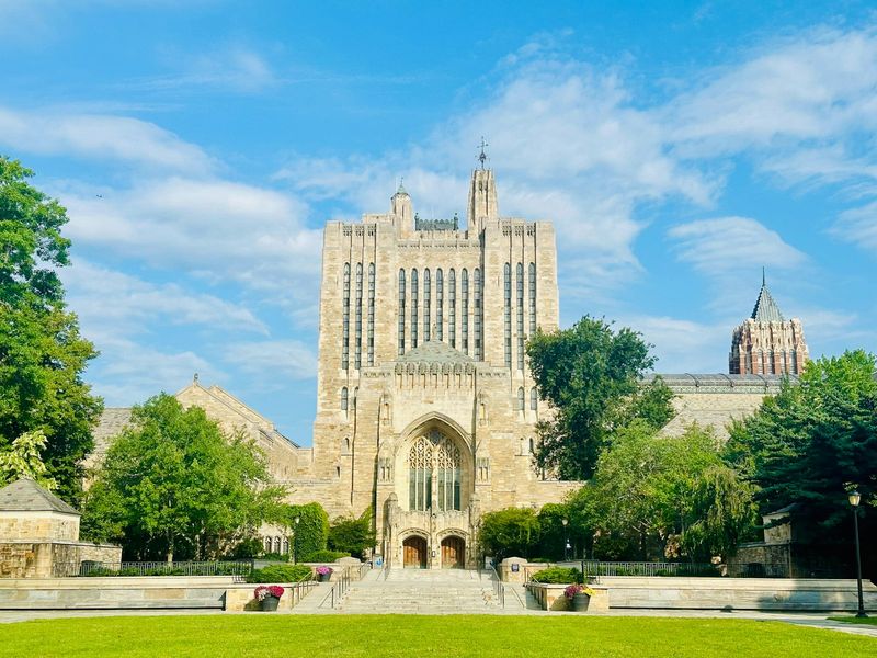 Yale University's iconic Gothic architecture featuring cathedral-style buildings and lush green grounds, representing the campus where many Yale Divinity School opportunities await