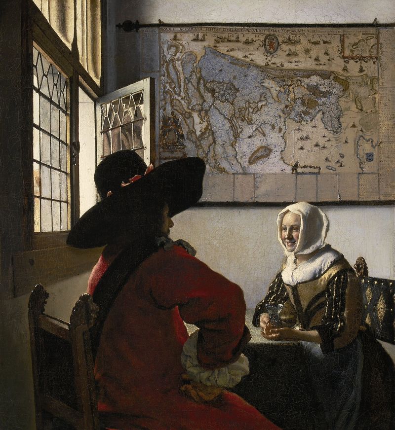 Johannes Vermeer, 'Officer and Laughing Girl' (c. 1657) — an intimate domestic scene of an officer (witness) sitting across the table from a woman, with light streaming through a leaded window. The kind of witnessed-in-the-presence moment that the Wills Act formalities are designed to capture.
