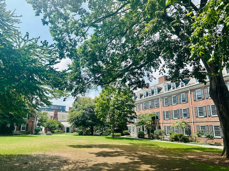 Yale University campus with a grassy field and historic buildings in the background